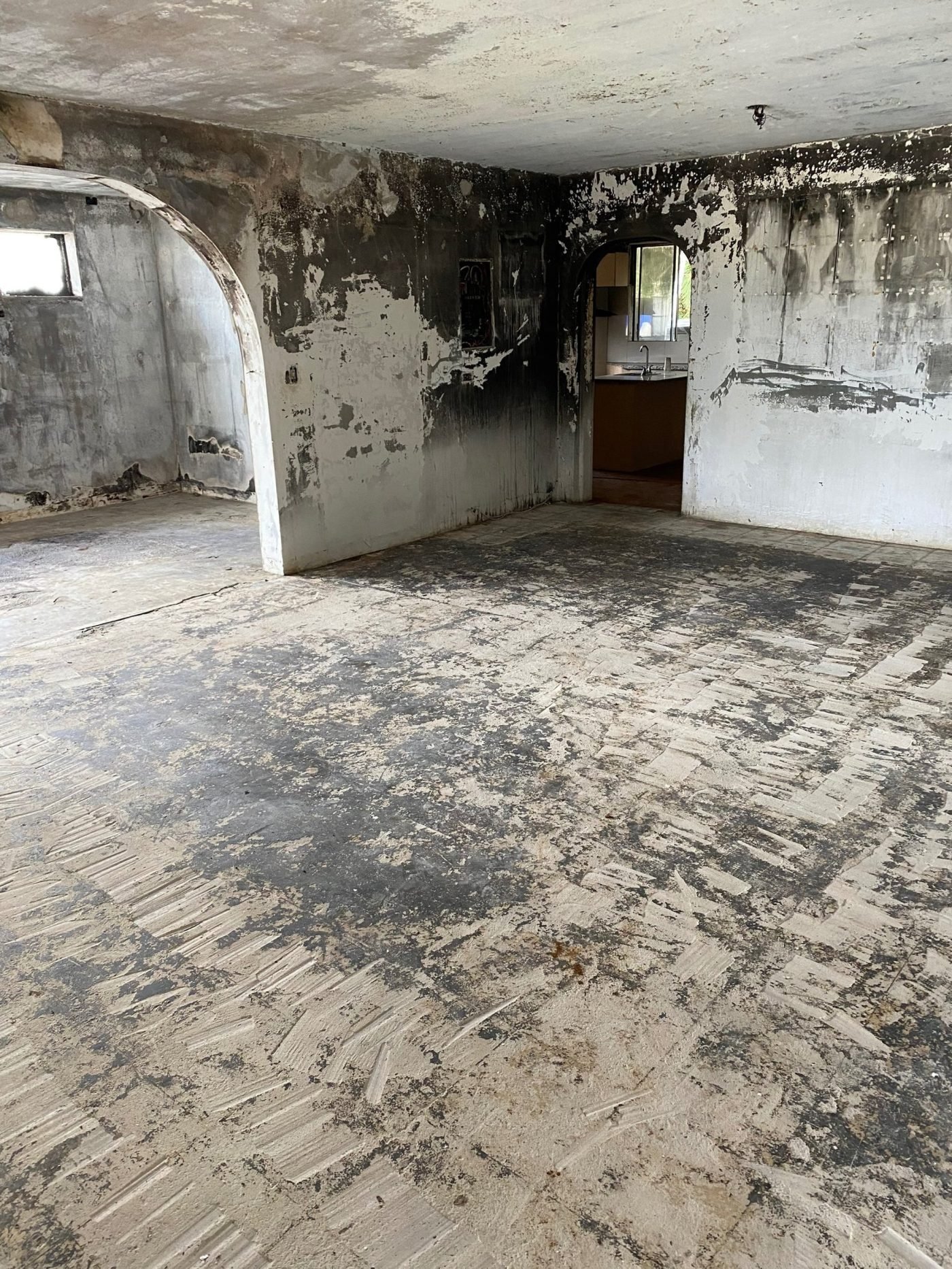 Interior gutted by fire, stripped back to charred structure